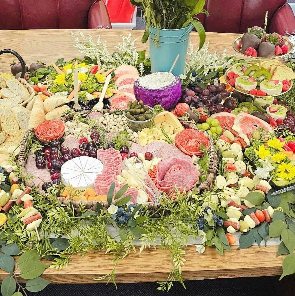 Grazing spread with salami roses, brie, fresh fruit, veggies and a tiered dessert stand
